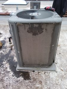 Dirty central air conditioner outside