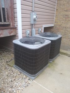 Central Air Conditioners outside of a multi-unit home