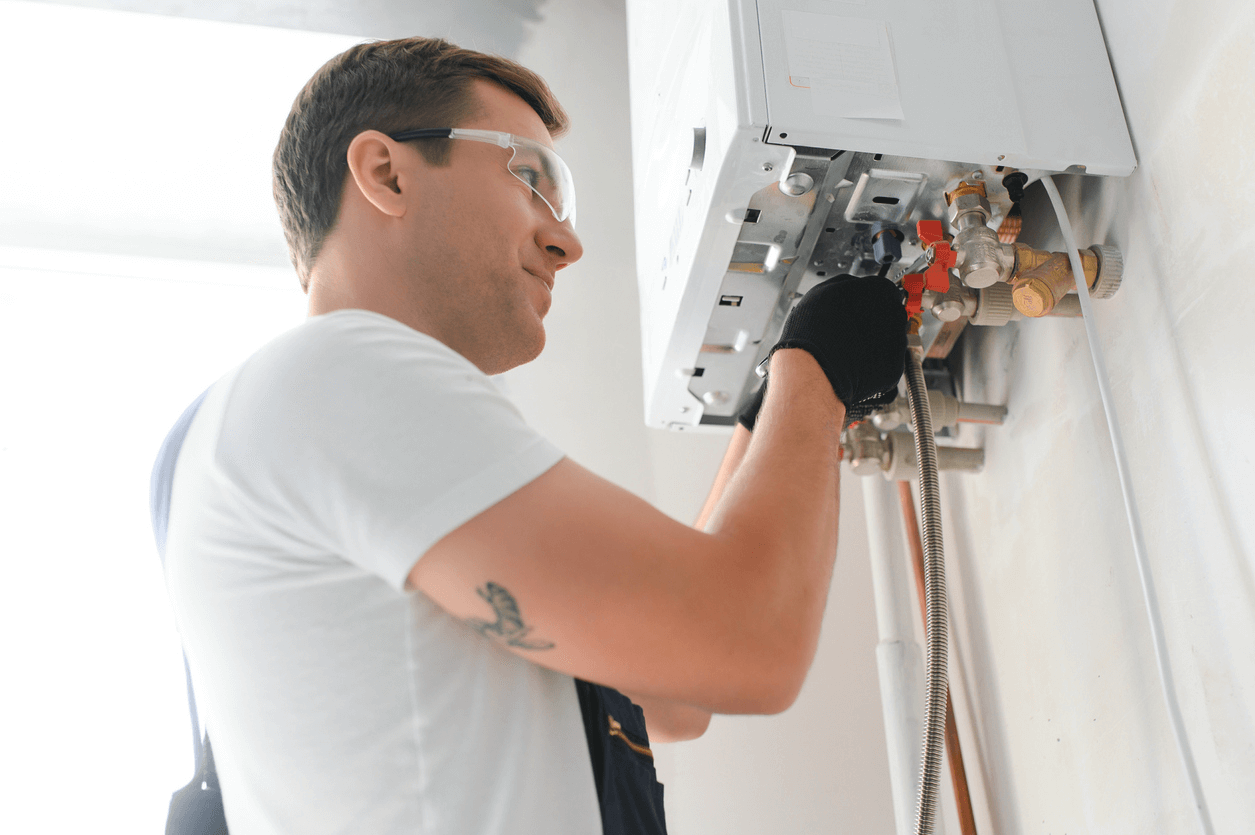 Professional technician checking a residential gas boiler